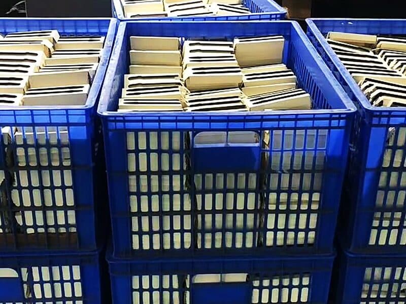 Finished folding cartons at quality control in the factory network